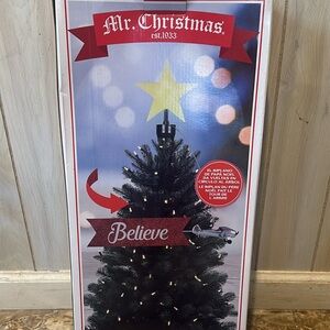 Mr. Christmas Santa Flying Plane Animated Tree Topper